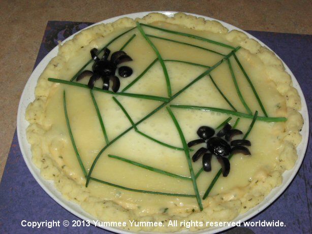 Put a spider web on your gluten-free pizza. This spider is edible if you like black olives.