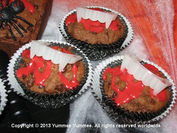 Triple Chocolate Muffins are scary fun with vampire fangs! Don't forget to add blood red frosting.