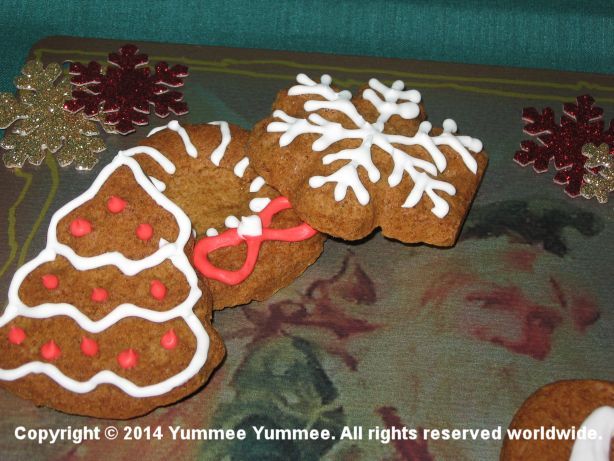Yummy! Gingerbread Cookies! Easy to make, bake, eat, and enjoy. Let your little elves help press in the cookie dough.