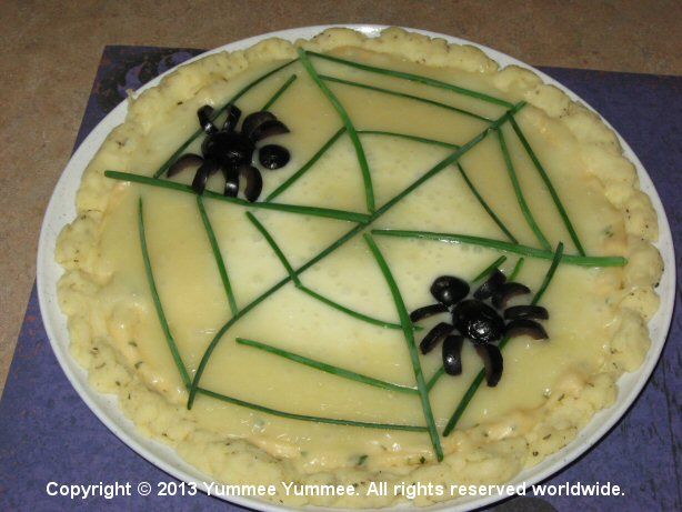 Put a spider web on your gluten-free pizza. This spider is edible if you like black olives. Put a spider web on your gluten-free pizza. This spider is edible if you like black olives.